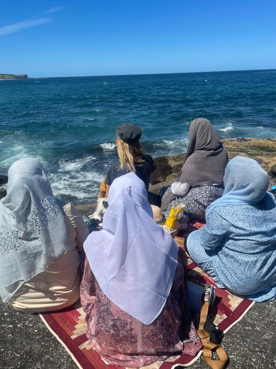 Group of women looking at the ocean