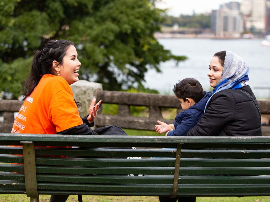Two women and child launching at Welcome Project event