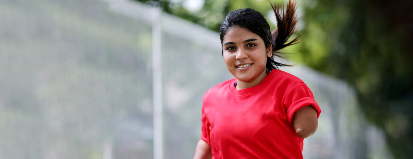 Girl smiling after taking part in a peer to peer disability support group