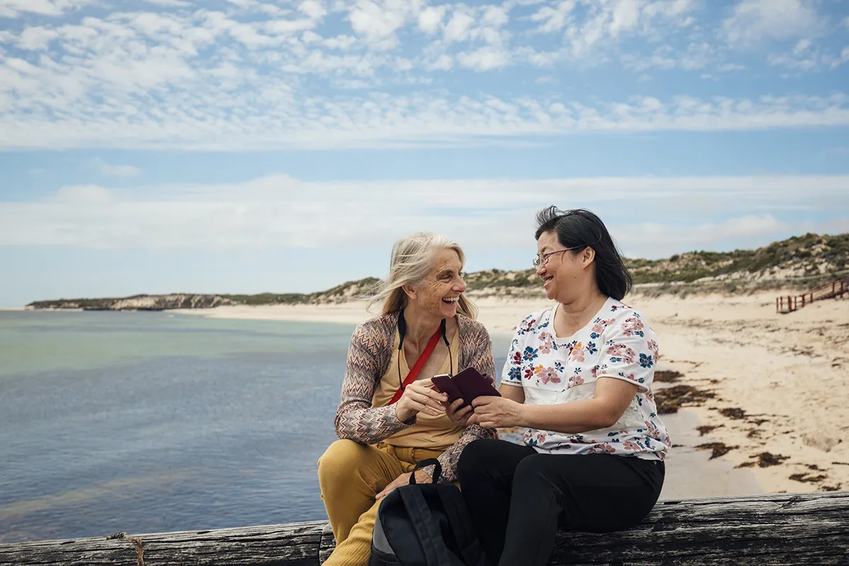 Carer holding hands with an elderly lady