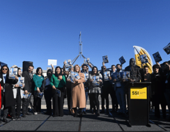 People smiling and launching the report in Canberra