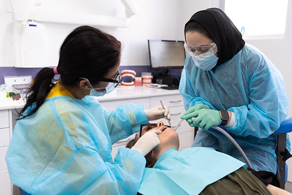 Sadia working with a patient