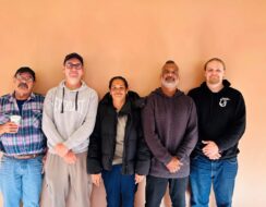 Artists in NAIDOC exhibition smile at camera