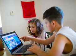 kids looking at a laptop screen