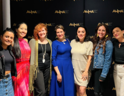 SSI delegation at the Australian Women in Music Awards, seven female artists posing for picture in front of a black media wall with logos