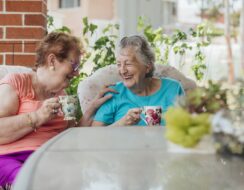 Two ladies have a drink and enjoy themselves.