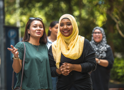Two women chatting on a walk