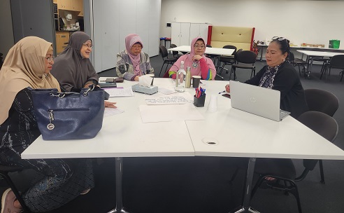 Group of women at information session about modern slavery