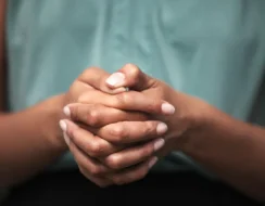 Hands of first line responders supporting women experiencing domestic violence