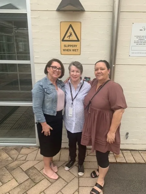 Women standing in front of building