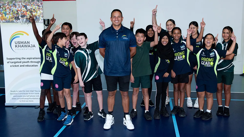 Australian cricketer Usman Khawaja with school kids