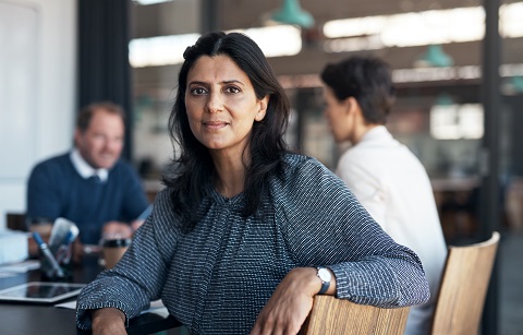 Woman at board table