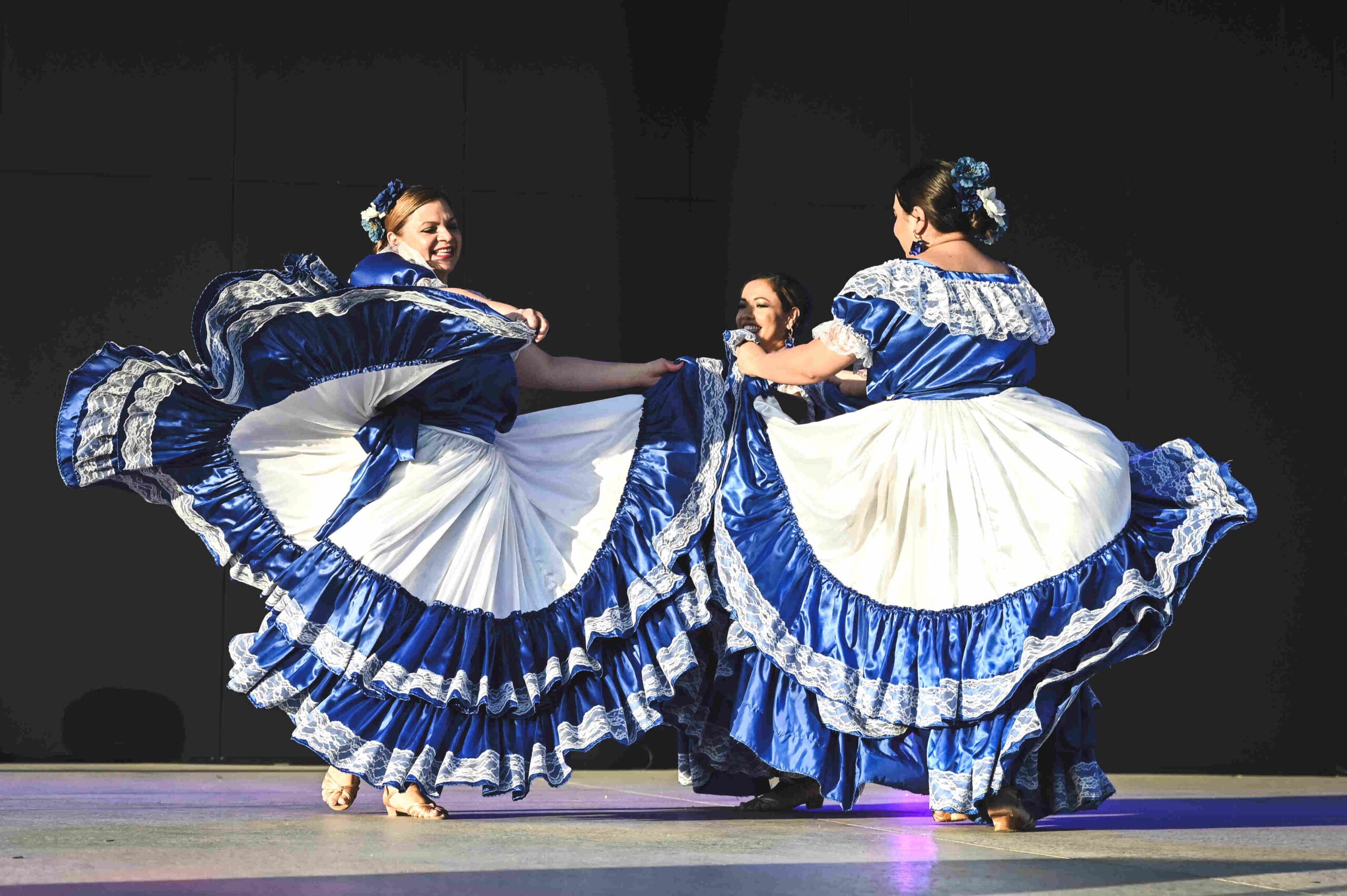 Three women dancing at World of Cultures 2024