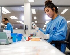 Skilled lab worker conducting experiment.