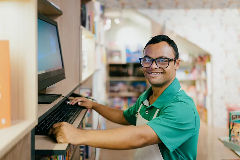 Man working on computer in store