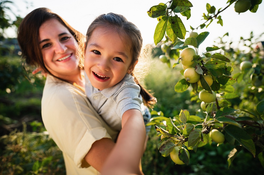 woman and young girl smiling