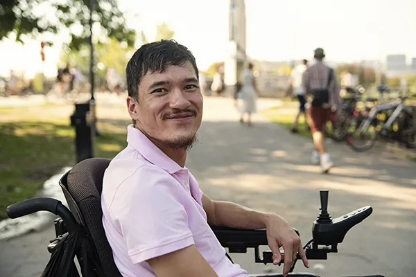 Asian man living with cerebral palsy