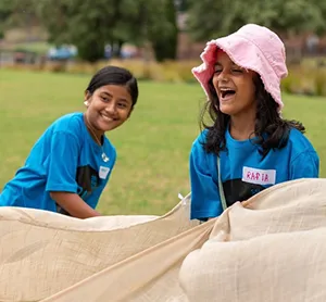 Holiday camp for SSI Humanitarian Settlement Program featuring children playing games