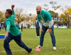 Cricketer Fawad Ahmed with school kids Refugee Week in Melbourne.